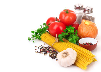 Pasta spaghetti with tomatoes, olive oil and basil on a white ba