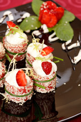 Tiramisu Sushi Roll garnished with Strawberry and Mint