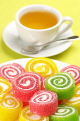 Colorful candy and tea