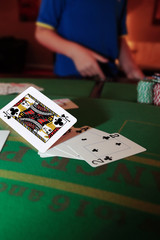 poker player throwing in a hand of cards