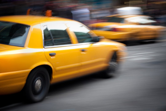 Speeding Yellow Taxi Cabs Motion Blur