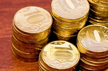 Golden coins on a wooden table