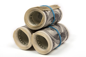 Three rolls from dollars on white background