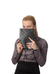 Businesswoman hid face behind notepad