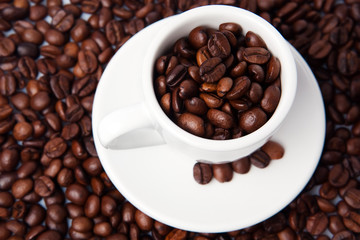 Cup full of coffee beans