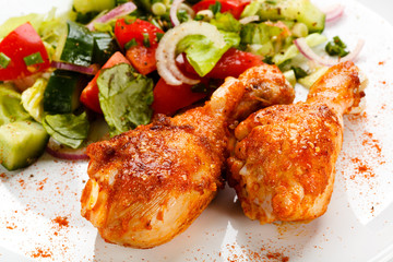 Roasted chicken drumsticks and vegetables