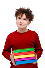 Young boy holding books isolated on white background