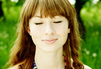 outdoor portrait of a woman with her eyes closed