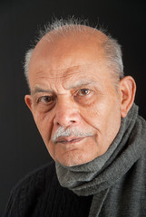 A portrait of a senior Indian man