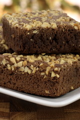 chocolate brownies with cracked peanuts on top