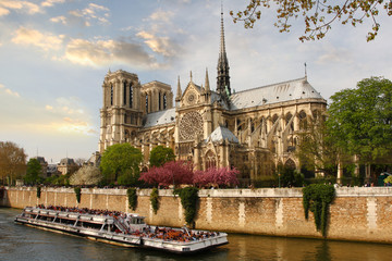 Paris, Notre Dame cathedral with boat on Seine