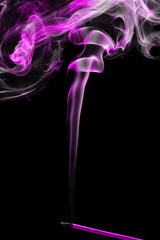 incense stick with smoke over black