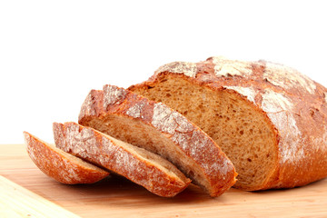 flavored sliced bread on a wooden stand isolated on white