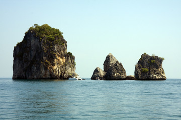 Fototapeta na wymiar Catamaran and limestone outcrops, Krabi, Thailand