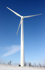 Windmill against deep blue sky