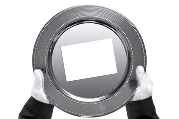 Butler holding a silver tray, shot from above