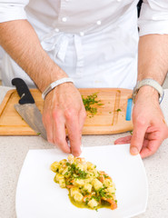 Chef decorate plate with food