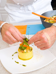 Chef decorate plate with food