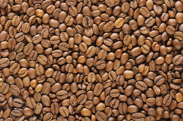food background with brown roasted natural coffee beans