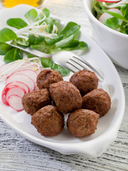 vegetarian meatballs with slice radish, soy sprout and salad