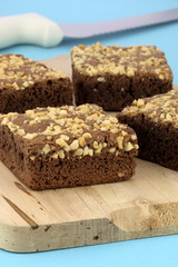 chocolate brownies with cracked peanuts on top