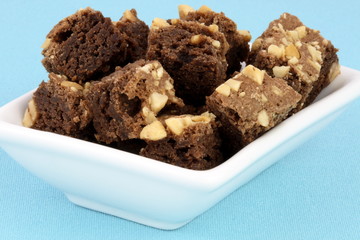 chocolate brownies with cracked peanuts on top