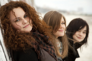 Three teen girlfriends at outdoor.