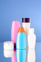 bottles of health and beauty products on blue background
