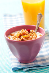 Breakfast with cereal with orange juice