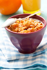 Breakfast with cereal, orange and orange juice