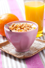 Breakfast with cereal, orange and orange juice