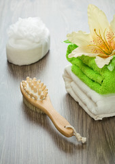 Obraz na płótnie Canvas flower on towels bath sponge massager and brush