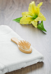 hairbrush and towel with flower
