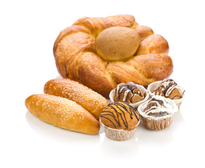 loaf with rolls and cakes