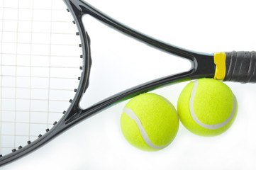 Two tennis balls and racket with isolated white background.