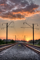 Fototapeta na wymiar Railway way on sunset of a sun