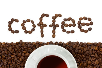 white coffee cup on the beans. Close up
