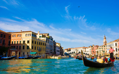 Venice Grand canal with gondolas and Rialto Bridge, Italy
