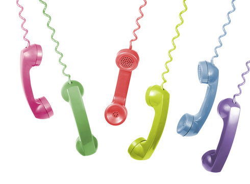 Colorful Vintage Phone Handsets  Hanging Isolated on white 
