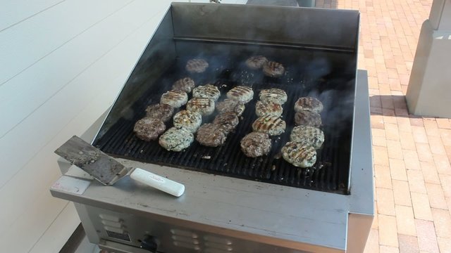 Rows Of Grilling Burgers