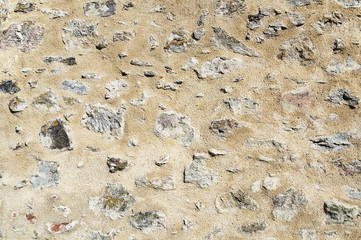 A rough wall made of cemented stones
