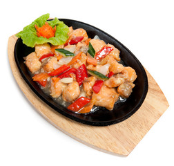 Roasted salmon with vegetables on frying pan