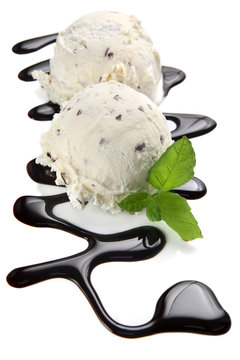 Stracciatella ice cream scoops with chocolate sauce