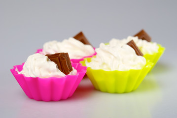 Four portions of whipped cream