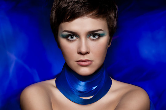 Brunette Woman Portrait With Blue Makeup