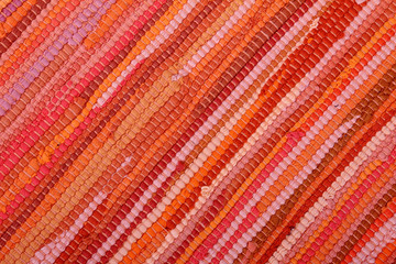 Striped Background in Warm Colors made from textile