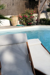 Swimming pool and deckchairs in Moraira Valencia Spain