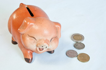 thai coins and drops piggy bank