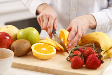 Woman cutting orange