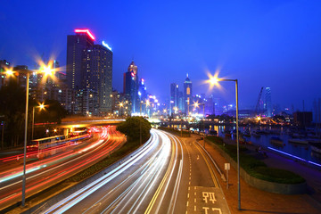 Fototapeta na wymiar Traffic though downtown of Hong Kong at night